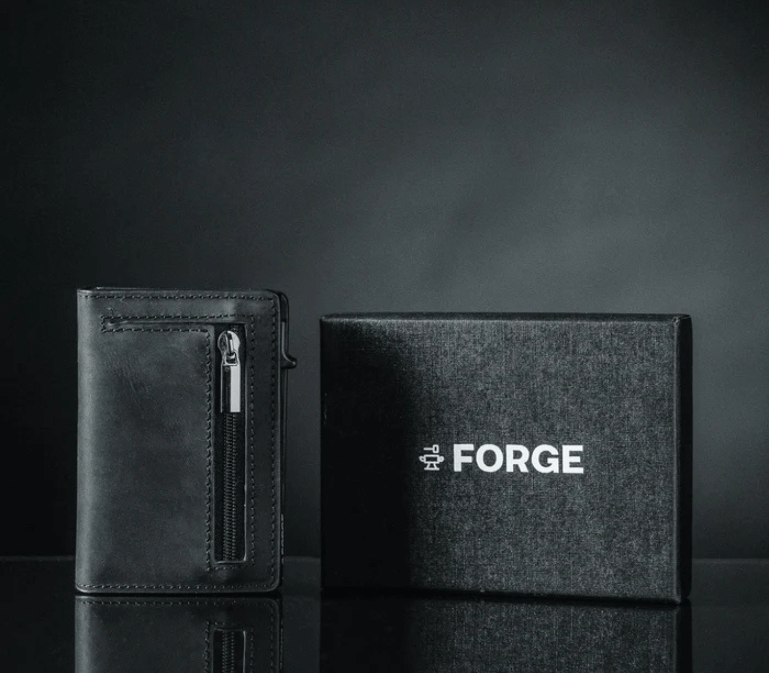 Black men’s leather wallet with zipper pocket displayed beside premium gift box packaging.