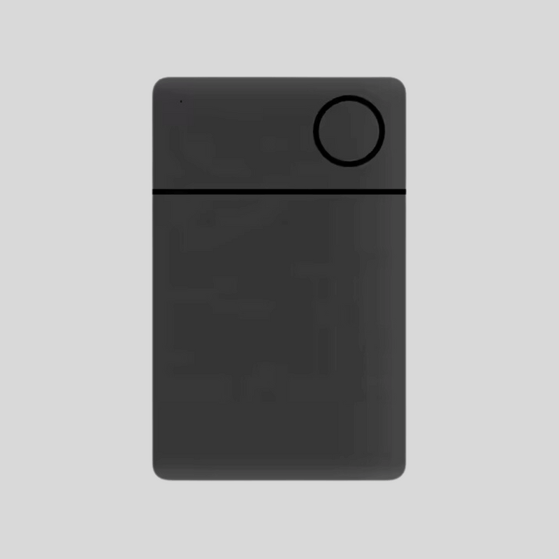 Minimalist black electronic device with circular feature on top right corner.